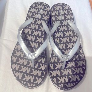 Michael Kors flip flops.